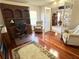 View of the study with hardwood floors, desk, and a view into the main bedroom at 3341 Pawleys N Loop, St Cloud, FL 34769