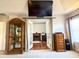 Sitting room featuring an entertainment center with fireplace and a view into the bedroom at 3341 Pawleys N Loop, St Cloud, FL 34769