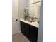 Stylish bar area featuring dark cabinets, countertop space, and a wine rack at 3920 Southern Vista Loop, St Cloud, FL 34772