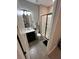 Stylish bathroom featuring a glass-enclosed shower, modern vanity, and neutral tile flooring at 3920 Southern Vista Loop, St Cloud, FL 34772