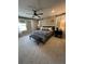 A cozy bedroom offers abundant natural light and a stylish seating area at 3920 Southern Vista Loop, St Cloud, FL 34772