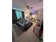 This modern bedroom is designed for entertainment with a unique bed frame and a cool color scheme at 3920 Southern Vista Loop, St Cloud, FL 34772