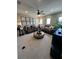 Comfortable living room with plush seating, a ceiling fan, and windows providing natural light at 3920 Southern Vista Loop, St Cloud, FL 34772