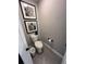 This well-lit toilet room features a toilet and decorative wall art at 3920 Southern Vista Loop, St Cloud, FL 34772