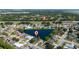 Gorgeous aerial view of a home nestled by a lake in a serene community with green surroundings and water views at 3928 Blackberry Cir, St Cloud, FL 34769
