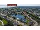 Beautiful aerial view showcasing a lakeside home in a peaceful neighborhood near East Lake Tohopekaliga, surrounded by greenery at 3928 Blackberry Cir, St Cloud, FL 34769
