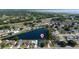 Stunning aerial view of a lakeside home nestled in a tranquil community with lush green surroundings and serene water views at 3928 Blackberry Cir, St Cloud, FL 34769