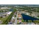 Aerial view of a charming home situated in a quiet neighborhood near a scenic lake and lush green spaces at 3928 Blackberry Cir, St Cloud, FL 34769
