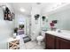 Bright bathroom featuring a glass shower, tile floors, and a single sink vanity at 3928 Blackberry Cir, St Cloud, FL 34769