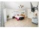 Bedroom showcasing tiled floors, modern furniture, and a ceiling fan at 3928 Blackberry Cir, St Cloud, FL 34769