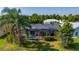Backyard with screened-in pool and lush greenery, offering privacy and outdoor enjoyment at 3928 Blackberry Cir, St Cloud, FL 34769