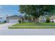 Charming single-story home with a well-manicured lawn and attached two-car garage at 3928 Blackberry Cir, St Cloud, FL 34769
