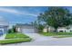 Attractive single-story home with a two-car garage and mature landscaping at 3928 Blackberry Cir, St Cloud, FL 34769