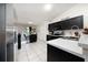 Well-equipped kitchen featuring sleek appliances, ample counter space, and a convenient breakfast bar area at 3928 Blackberry Cir, St Cloud, FL 34769