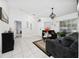 Inviting living room with neutral walls, tile floors, and comfortable seating at 3928 Blackberry Cir, St Cloud, FL 34769