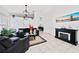 Bright living room features tile flooring, a modern fireplace, and stylish decor at 3928 Blackberry Cir, St Cloud, FL 34769