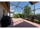 Spacious screened lanai with a view of the green backyard, perfect for outdoor living at 3928 Blackberry Cir, St Cloud, FL 34769