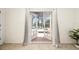 French doors opening to a private pool and spa area, with serene views of the lake at 3928 Blackberry Cir, St Cloud, FL 34769