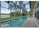 Relaxing screened-in pool with lovely lake views, perfect for enjoying the Florida sunshine at 3928 Blackberry Cir, St Cloud, FL 34769