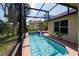Sparkling screened pool with a water feature, offering a private oasis in a lush backyard at 3928 Blackberry Cir, St Cloud, FL 34769