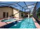 Private screened pool and spa area offering a relaxing retreat with a bubbling water feature at 3928 Blackberry Cir, St Cloud, FL 34769