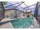 The backyard features a screened-in pool and spa for ultimate relaxation at 3928 Blackberry Cir, St Cloud, FL 34769