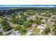 Aerial view of a residential neighborhood with lush trees and various homes at 401 Maryland Ave, St Cloud, FL 34769