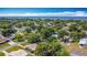Scenic aerial view showcasing a residential neighborhood with lush greenery, glimpses of the tranquil bay, and charming homes at 401 Maryland Ave, St Cloud, FL 34769
