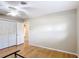 Minimalist bedroom with hardwood floors, ample closet space, and neutral tones, offering a serene retreat at 401 Maryland Ave, St Cloud, FL 34769
