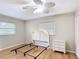 Light-filled bedroom with hardwood floors, offering a blank canvas for personalization and relaxation at 401 Maryland Ave, St Cloud, FL 34769