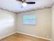 This bedroom features a ceiling fan, hardwood floors and a window with blinds at 401 Maryland Ave, St Cloud, FL 34769