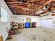 Spacious garage featuring workbench, storage shelves, and a window for natural light at 401 Maryland Ave, St Cloud, FL 34769