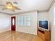 Hardwood floors and a tropical ceiling fan add charm to this living space at 401 Maryland Ave, St Cloud, FL 34769
