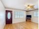 Spacious living room with hardwood floors, custom door and window shutters at 401 Maryland Ave, St Cloud, FL 34769