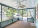 Comfortable screened-in porch perfect for relaxing with a ceiling fan at 401 Maryland Ave, St Cloud, FL 34769