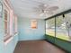 Inviting screened porch with ceiling fan and views of the neighborhood at 401 Maryland Ave, St Cloud, FL 34769