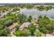 Aerial view of a waterfront property with lush landscaping and lake access at 430 Bywater Dr, Orlando, FL 32839