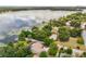Aerial view of estate with a pool, lush landscaping, and lake access at 430 Bywater Dr, Orlando, FL 32839