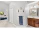 Bright bathroom area featuring a vanity and a glimpse into a bedroom at 430 Bywater Dr, Orlando, FL 32839