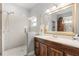 Bright bathroom featuring a frameless glass shower and wood vanity with marble top at 430 Bywater Dr, Orlando, FL 32839
