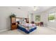 This bedroom includes a large bed, a window, and lots of space at 430 Bywater Dr, Orlando, FL 32839