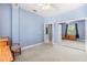 Comfortable bedroom offers soft blue walls, plush carpet and lots of light at 430 Bywater Dr, Orlando, FL 32839
