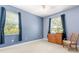 This bedroom features soft blue walls, plush carpet and lots of light at 430 Bywater Dr, Orlando, FL 32839