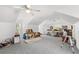 This bonus room features carpet, dual ceiling fans, and natural light from several windows at 430 Bywater Dr, Orlando, FL 32839