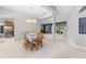Dining area with a chandelier, tile floors, and seamless transition to the kitchen and living spaces at 430 Bywater Dr, Orlando, FL 32839