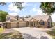 Charming home featuring a brick and siding exterior, a spacious driveway, and a well-manicured lawn at 430 Bywater Dr, Orlando, FL 32839