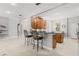 Open kitchen with breakfast bar, granite countertops, stainless appliances, and natural wood cabinets at 430 Bywater Dr, Orlando, FL 32839