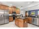 Modern kitchen boasts stainless steel appliances, granite countertops, and a center island at 430 Bywater Dr, Orlando, FL 32839