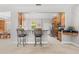Bright open kitchen features updated appliances, wooden cabinetry, and breakfast bar at 430 Bywater Dr, Orlando, FL 32839