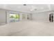 Spacious living room with neutral carpet, ceiling fan, and sliding glass doors at 430 Bywater Dr, Orlando, FL 32839